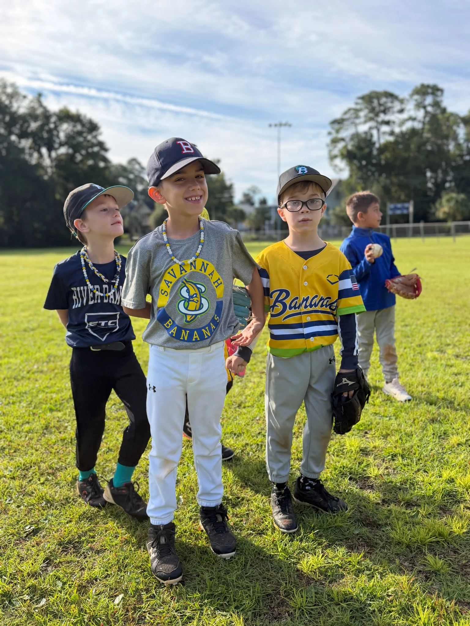 teammates on the outfield grass